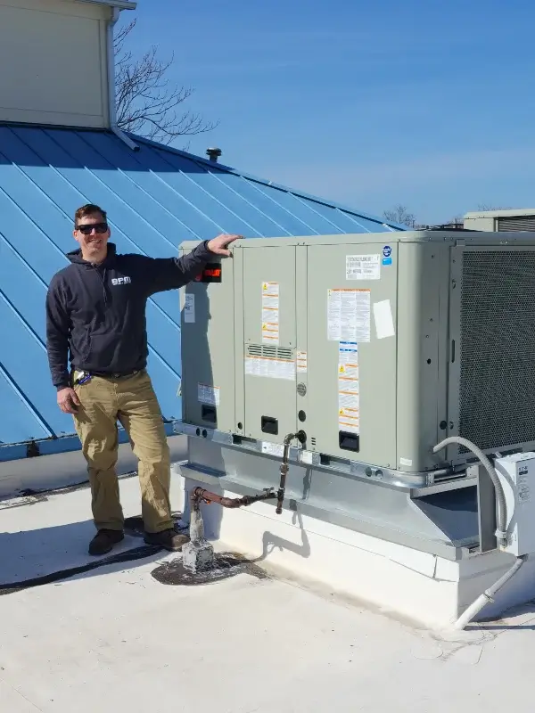Bert Miskell Owner in roof with Commercial HVAC system